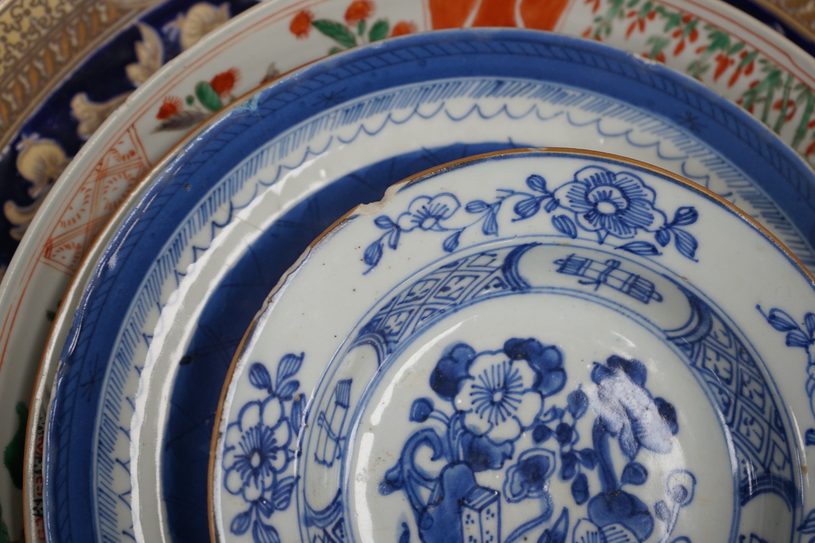 A group of 18th century and later Chinese enamelled and blue and white porcelain dishes and three bowls, Largest dish 35.5 cm diameter